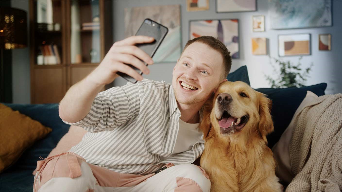 A dog and a cat sitting together under the words "Protect for less"