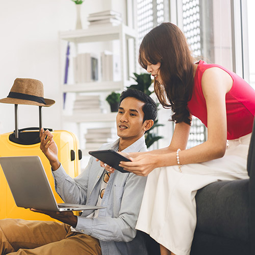 Couple looking at a laptop